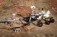 This grouping of two test rovers and a flight spare provides a graphic comparison of three generations of Mars rovers developed at NASA's Jet Propulsion Laboratory, Pasadena, Calif. Original from NASA . Digitally enhanced by rawpixel.