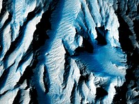 This observation from NASA&#39;s Mars Reconnaissance Orbiter is of an east-facing slope in Tithonium Chasma. Original from NASA. Digitally enhanced by rawpixel.