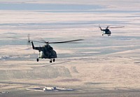 Rescue helicopters fly Expedition 16 crew to Kustanay, Kazakhstan shortly after their Soyuz TMA-11 spacecraft landed in central Kazakhstan. Original from NASA. Digitally enhanced by rawpixel.