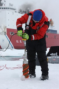 Benny Hopson from the Barrow Arctic Science Consortium in Alaska drills a core sample from sea ice in the Chukchi Sea on July 4, 2010. Original from NASA. Digitally enhanced by rawpixel.