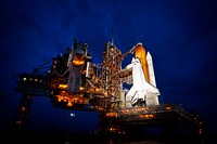The space shuttle Atlantis is seen shortly after the rotating service structure (RSS) was rolled back at launch pad 39a, Thursday, July 7, 2011 at the NASA Kennedy Space Center in Cape Canaveral, Fla. Original from NASA . Digitally enhanced by rawpixel