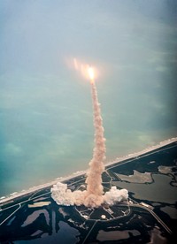 Space shuttle Atlantis is seen through the window of a Shuttle Training Aircraft (STA) as it launches from launch pad 39A at Kennedy Space Center on the STS-135 mission, Friday, July 8, 2011 in Cape Canaveral, Fla. Original from NASA. Digitally enhanced by rawpixel