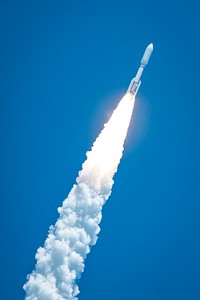 Rising from fire and smoke, NASA's Juno planetary probe, enclosed in its payload fairing, launches atop a United Launch Alliance Atlas V rocket. Original from NASA . Digitally enhanced by rawpixel.