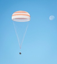 The Soyuz TMA-21 spacecraft is seen as it lands with Expedition 28 in a remote area outside of the town of Zhezkazgan, Kazakhstan, Sept. 16, 2011. Original from NASA. Digitally enhanced by rawpixel.