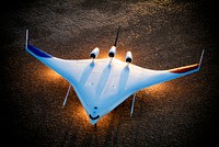 Boeing's X-48B Blended Wing Body technology demonstrator shows off its unique lines at sunset on Rogers Dry Lake adjacent to NASA DFRC. 2006-10-24. Original from NASA. Digitally enhanced by rawpixel.