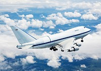 NASA's Boeing 747SP SOFIA airborne observatory soars over a bed of puffy clouds during its second checkout flight over the Texas countryside on May 10, 2007. Original from NASA. Digitally enhanced by rawpixel.