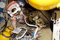 Cosmonaut Pavel V. Vinogradov wearing Russian Orlan Space Suit in the Pirs Docking Compartment (DC1) during Expedition 13. Original from NASA. Digitally enhanced by rawpixel.