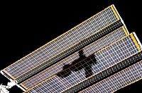 The shadow of the Soyuz TMA-14 spacecraft is visible against solar array panels of the International Space Station during the relocation of the Soyuz from the Zvezda Service Module&rsquo;s aft port to the Pirs Docking Compartment. Original from NASA. Digitally enhanced by rawpixel.