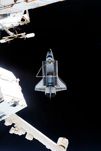 This picture of the space shuttle Atlantis was photographed from the International Space Station as the orbiting complex and the shuttle performed their relative separation in the early hours of July 19, 2011. Original from NASA . Digitally enhanced by rawpixel.