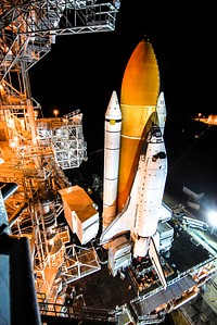 The mobile launcher platform with space shuttle Endeavour on top comes to rest on Launch Pad 39A. Original from NASA. Digitally enhanced by rawpixel.