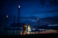 Just before dawn, space shuttle Endeavour is bathed in xenon lights after being secured on Launch Pad 39B. Original from NASA. Digitally enhanced by rawpixel.