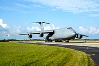 The U.S. Air Force C-17 aircraft arrives at NASA Kennedy Space Center&#39;s Shuttle Landing Facility with its SV-1 cargo of the STSS Demonstrator spacecraft. Original from NASA. Digitally enhanced by rawpixel.