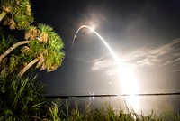 Viewed from the Banana River Viewing Site at NASA's Kennedy Space Center in Florida, space shuttle Discovery arcs through a cloud-brushed sky lighted by the trail of fire after launch on the STS-128 mission. Original from NASA. Digitally enhanced by rawpixel.