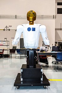 In the Space Station Processing Facility at NASA&#39;s Kennedy Space Center in Florida, the dexterous humanoid astronaut helper, Robonaut (R2) is on display during a media event hosted by NASA. Original from NASA. Digitally enhanced by rawpixel.
