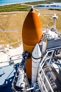 On Launch Pad 39A at NASA&#39;s Kennedy Space Center in Florida, a new 7-inch quick disconnect is installed on the ground umbilical carrier plate of space shuttle Discovery&#39;s external fuel tank.