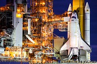 At NASA's Kennedy Space Center in Florida, the STS-133 payload canister is lifted into the rotating service structure on Launch Pad 39A. The payload then will be moved into space shuttle Discovery's payload bay. Original from NASA . Digitally enhanced by rawpixel.