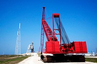 At NASA's Kennedy Space Center in Florida, a heavy-duty crane is slowly making its way to Launch Pad 39B. Original from NASA. Digitally enhanced by rawpixel.