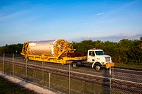 At Cape Canaveral Air Force Station in Florida, NASA's Juno spacecraft, is being transported from the Atlas Spaceflight Operations Center for delivery to Launch Complex 41. Original from NASA . Digitally enhanced by rawpixel.