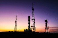 With the sun setting in the background at NASA&rsquo;s Kennedy Space Center in Florida, the mobile launcher is nearing completion of its 4.2-mile journey to Launch Pad 39B. Original from NASA . Digitally enhanced by rawpixel.