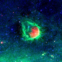 This glowing emerald nebula seen by NASA Spitzer Space Telescope is named RCW 120. Original from NASA. Digitally enhanced by rawpixel.
