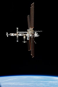 This picture of the International Space Station was photographed from the space shuttle Atlantis in the early hours of July 19, 2011. Original from NASA. Digitally enhanced by rawpixel.