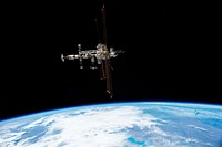 This picture of the International Space Station was photographed from the space shuttle Atlantis in the early hours of July 19, 2011. Original from NASA . Digitally enhanced by rawpixel.