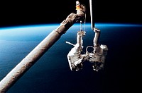 Astronaut Mark C. Lee (right) floats freely as he continues to test the new Simplified Aid for EVA Rescue (SAFER) system while converging with astronaut Carl J. Meade (left). Original from NASA . Digitally enhanced by rawpixel.