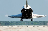 Space shuttle Atlantis nears touchdown on Runway 33 at the Shuttle Landing Facility at NASA&#39;s Kennedy Space Center in Florida. Original from NASA . Digitally enhanced by rawpixel.