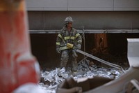 Rescue officer during the aftermath of the September 11 terrorist attack on the World Trade Center, New York City. Courtesy of the Prints and Photographs Division, Library of Congress. Digitally enhanced by rawpixel.