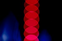 Red blurred lights on dark blue background