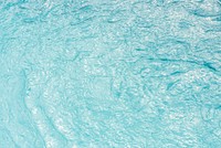Swimming pool water texture in sunlight background