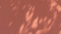 Tropical leaf computer wallpaper, shadow on pinkish brown background