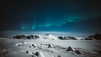 Northern lights over snowy Greenland