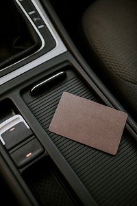 Blank brown business card on a center of car console space