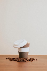 Cork reusable coffee cup with coffee beans
