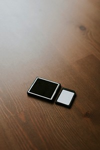 Micro SD cards and card adapter on wooden background