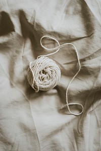 Natural cotton yarn on gray textile background