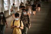 Commuters on skywalk during COVID-19 situation. BANGKOK, THAILAND, 16 APRIL 2021