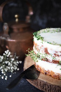 Buttercream cake decorated with thyme