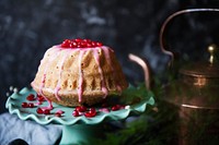 Dome shaped cake topped with pomegranate