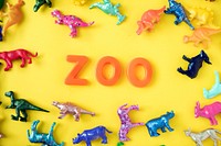 Various animal toy figures background with the word zoo