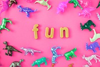 Various animal toy figures background with the word fun