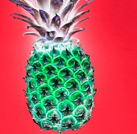 Aerial view of pineapple in negative filter red background