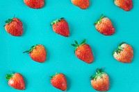 Pattern of yummy strawberries on blue background