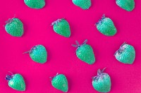 Neon green strawberries on pink patterned background