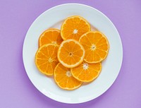 Closeup of a plate of sliced juicy orange