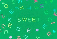 Sweet spelled word with alphabets background