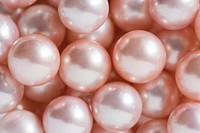Closeup of pink pearls textured background