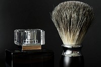 Closeup of shaving brush and perfume