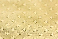 Shiny gold textured star patterned paper background